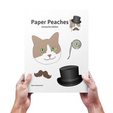 Load image into Gallery viewer, A pair of hands holding a copy of the printable cat paper doll
